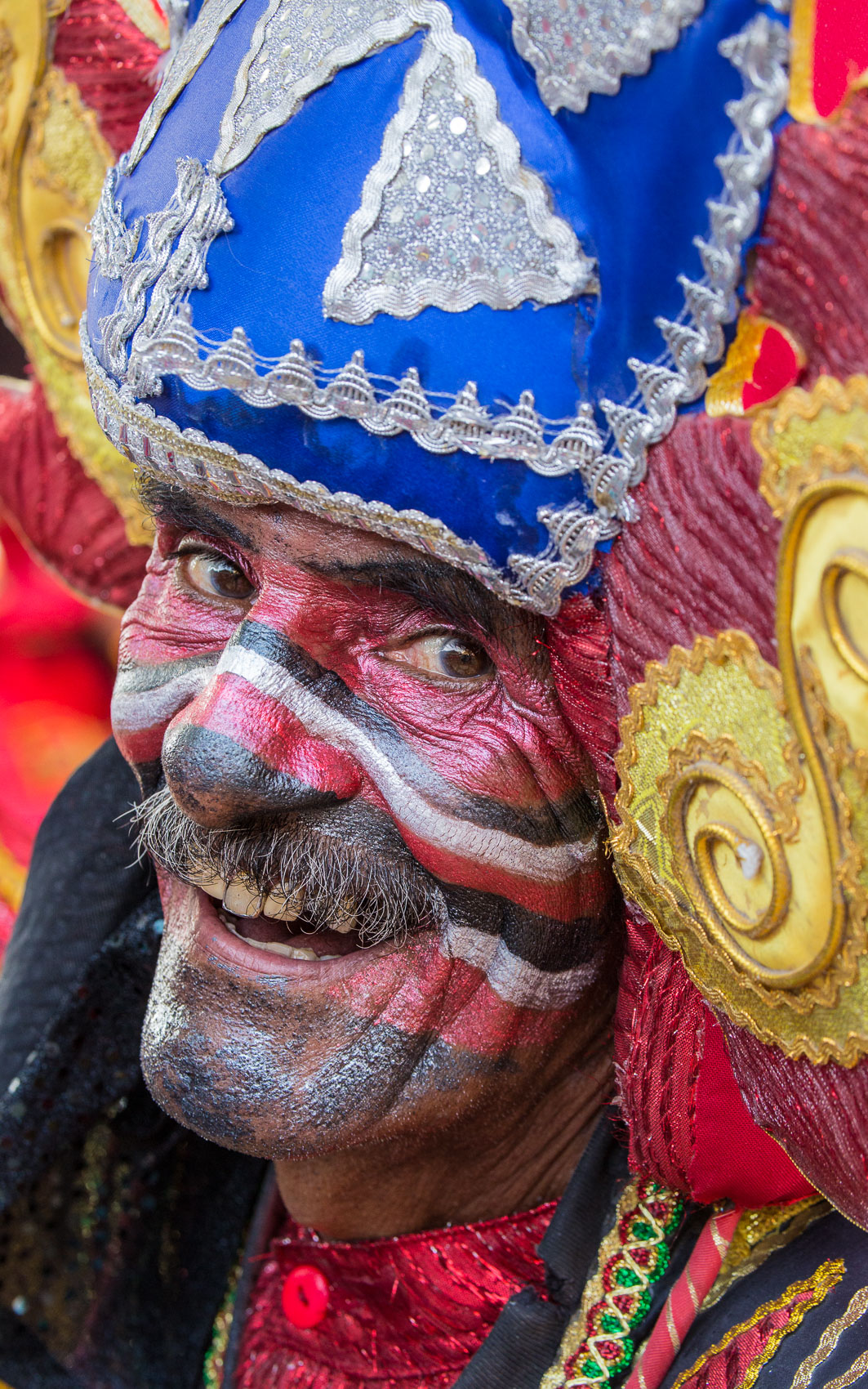 Colombia-Barranquilla-Carnival-Red-Face-Blue-Hat