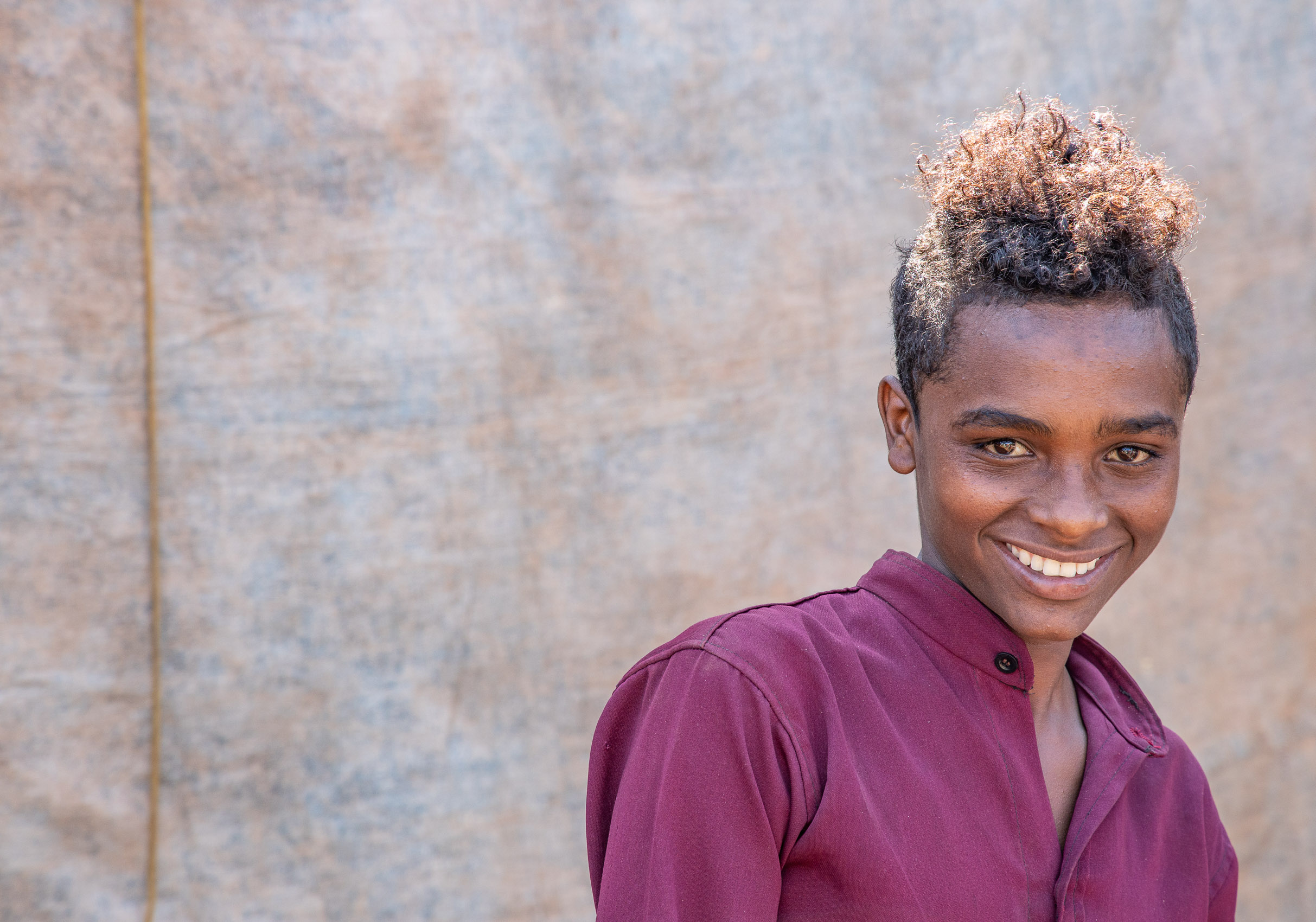Ethiopia-Mizan-Teferi-Burgundy-Shirt-Smile