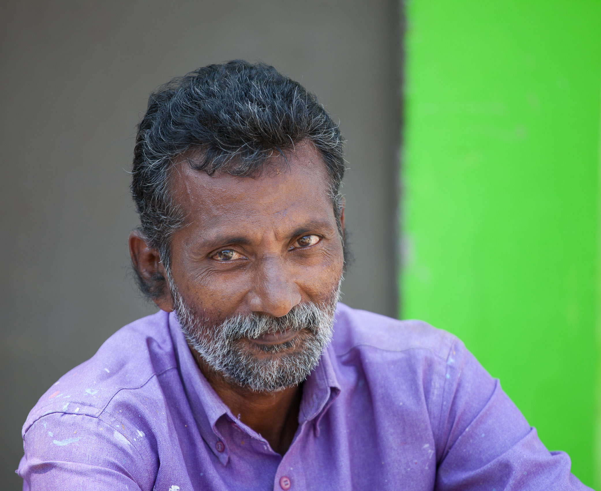 India-Kerala-Cochin-Purple-Shirt-Green-Wall